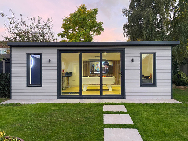 Grey-clad build with a games room inside